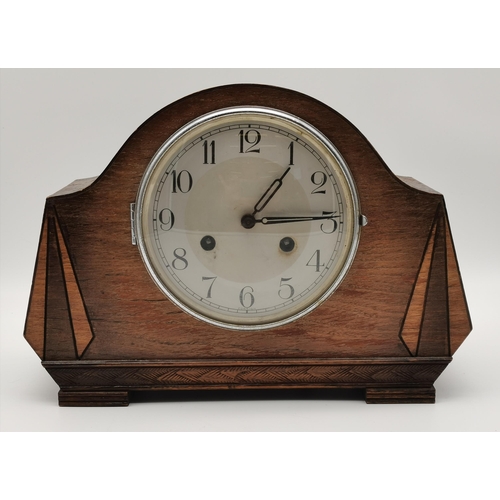 13 - An Art Deco wooden mantel clock, the movement signed 'HALLER Foreign fff'. 23cm high