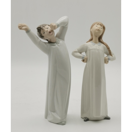 163 - A collection of 3 Lladro and 2 Nao figurines including Girl with Rabbit, Girl with Lamb, Boy Yawning... 