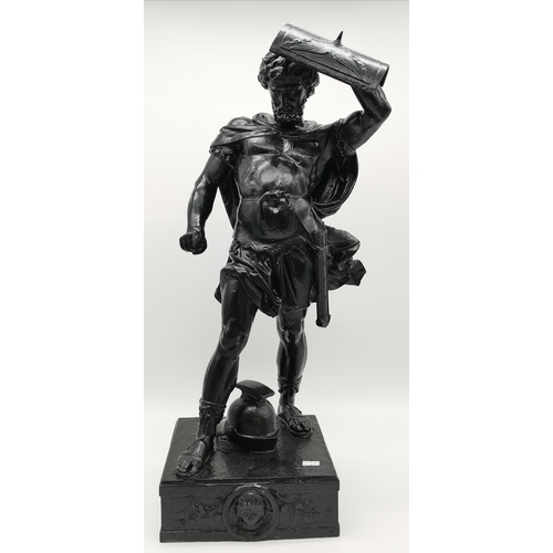 17 - A large metal sculpture of a Roman warrior, standing on a square plinth, helmet between his feet, sh... 