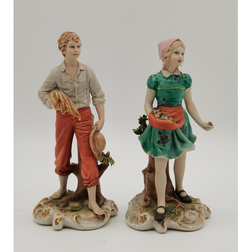 173 - Two Capodimonte figures by Sandro Maggioni, a girl picking flowers and a boy carrying wheat, blue pr... 