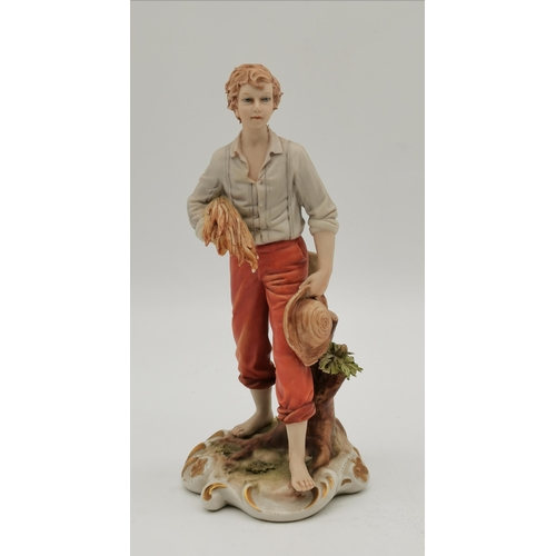 173 - Two Capodimonte figures by Sandro Maggioni, a girl picking flowers and a boy carrying wheat, blue pr... 