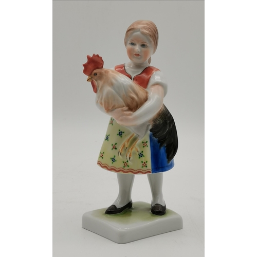 185 - A Herend porcelain model of a girl holding a cockerel, no.5562; a Herend twin-handled oval dish and ... 