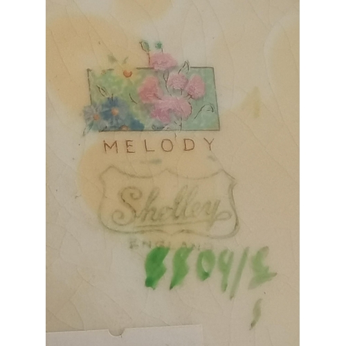 187 - A Shelley 'Melody' milk jug, the green patterned ground with multicoloured floral sprays, (a/f). 13.... 