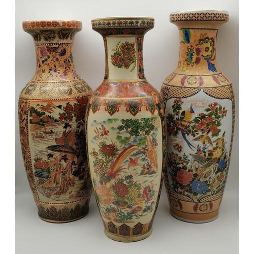 19 - Three tall Chinese vases, 20th Century, slender baluster with trumpet necks, variously decorated wit... 