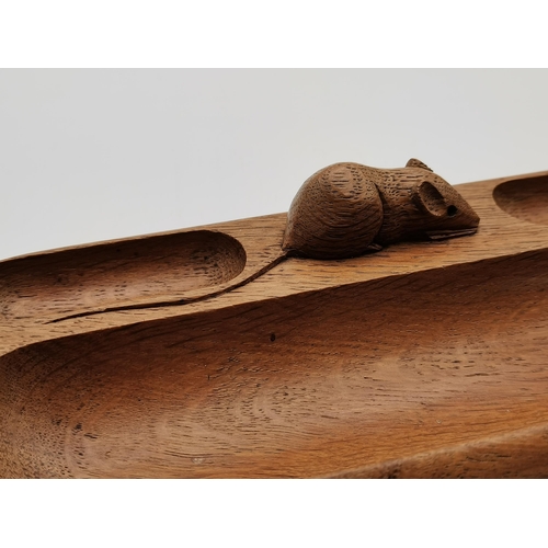 192 - Robert Thompson, a Mouseman oak pen tray, elongated oval with penny moulding to the outer edge, thre... 