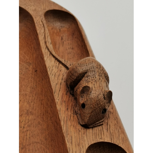 192 - Robert Thompson, a Mouseman oak pen tray, elongated oval with penny moulding to the outer edge, thre... 