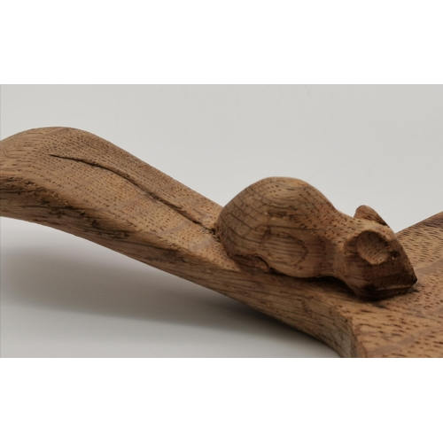 193 - Robert Thompson, a Mouseman oak cheese board, oval, the surface lightly adzed, with carved mouse sig... 