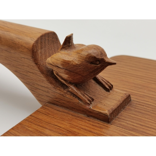 197 - Bob Hunter, a Wrenman oak cheese board, rounded rectangular, the dowelled handle with carved wren si... 