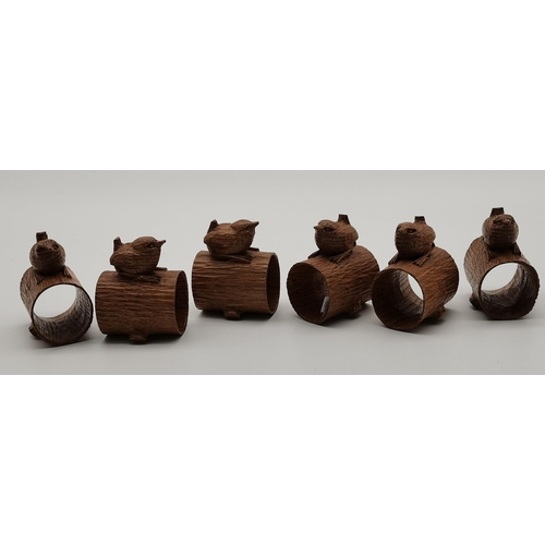 199 - Bob Hunter, a set of six Wrenman oak napkin rings, each with carved wren signature atop a hollowed o... 