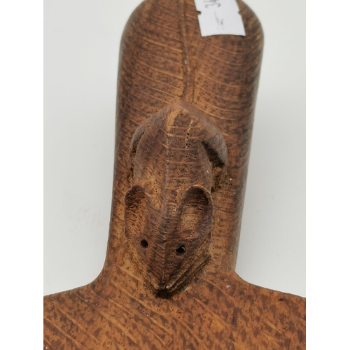 202 - Robert Thompson, a Mouseman oak cheese board, oval, with carved mouse signature to handle. 39cm long... 