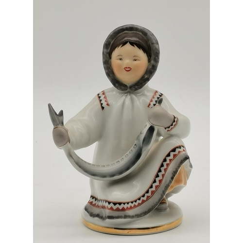 207 - Russian porcelain figure of Eskimo holding a fish, 14cm high, English Porcelain figurine of lady sel... 