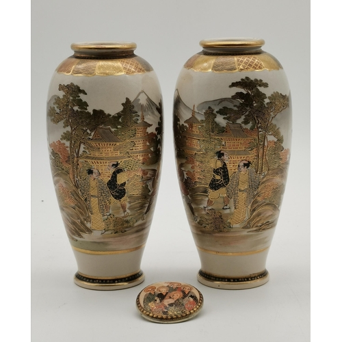 208 - A pair of Japanese Satsuma vases, decorated with figures before pagodas, in a mountain and lake land... 