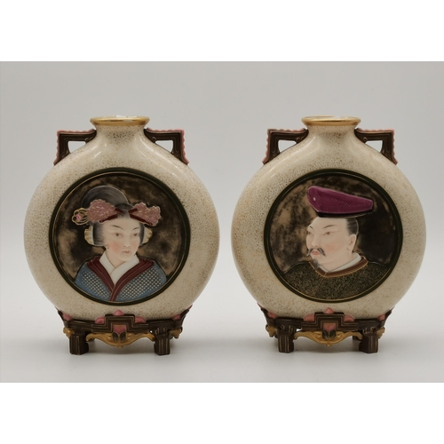 214 - A pair of Royal Worcester porcelain Japanese style moon flask vases, late 19th Century, with speckle... 