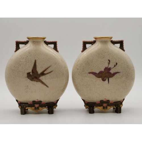 214 - A pair of Royal Worcester porcelain Japanese style moon flask vases, late 19th Century, with speckle... 