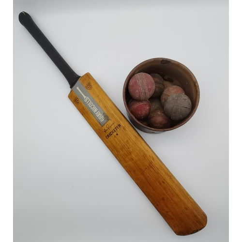 23 - A Gray-Nicolls 'Cricketer' cricket bat, together with six leather cricket balls. (Qty)