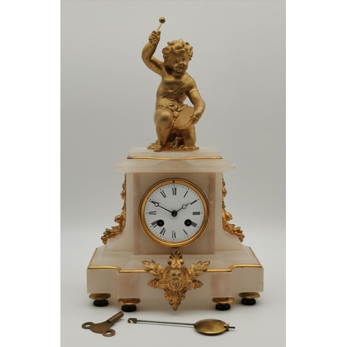 24 - A late 19th Century French mantel clock, the alabaster body surmounted by a gilt-metal putto playing... 