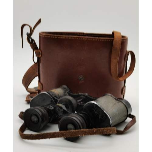 253 - A pair of binoculars by Ross London, 12x50 STEPSUN no.146127, with leather strap. 19.8cm high plus t... 