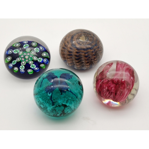 278 - A collection of glass paperweights and ceramic and marble eggs