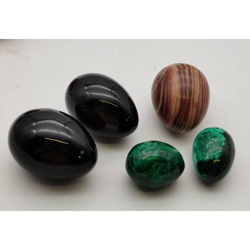 278 - A collection of glass paperweights and ceramic and marble eggs