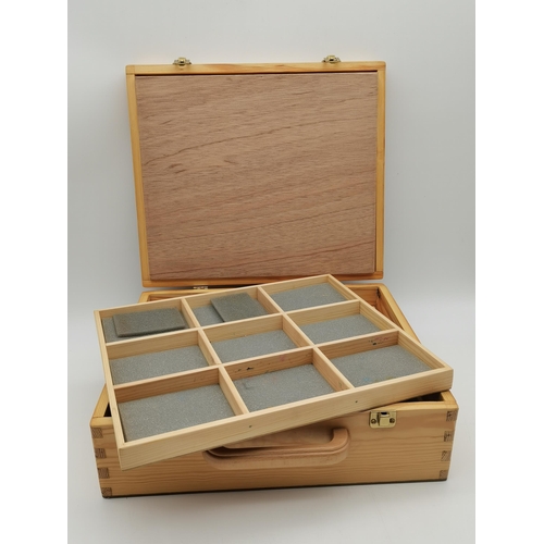 297 - A modern wooden craft box, with three removable compartmentalised trays; together with a small album... 