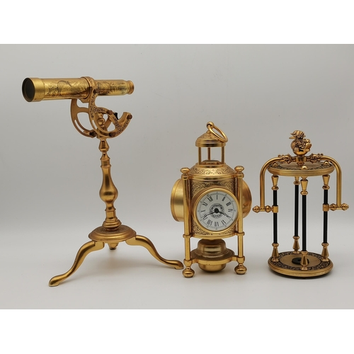 30 - Three modern gilt-metal desk instruments, comprising a miniature telescope by The Franklin Mint, a s... 