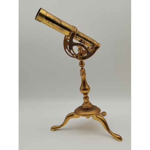 30 - Three modern gilt-metal desk instruments, comprising a miniature telescope by The Franklin Mint, a s... 