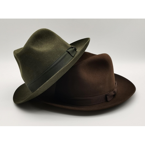 302 - A collection of four gent's hats, comprising a Panama with navy and burgundy ribbon, together with t... 