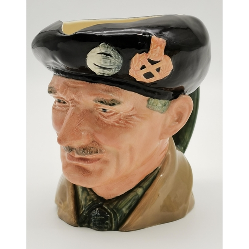 311 - A Royal Doulton character jug, 'Monty' (D6202), and a WW1 trench art shell jug engraved 'Souvenier (... 