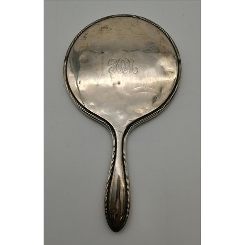 363 - A quantity of silver and silver-plated wares comprising a circular silver-backed hand mirror, marks ... 