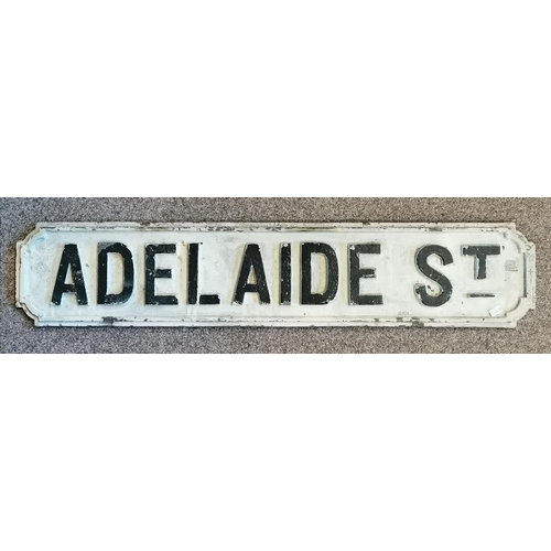 6 - A cast iron street sign, 'Adelaide St.', the black painted raised lettering to a cream ground. 17.5c... 