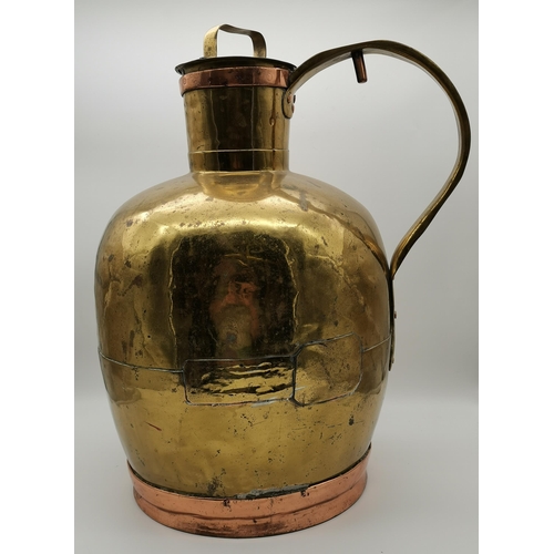 65 - A large brass and copper Dutch milk churn, jug form, the bulbous brass body with narrow cylindrical ... 