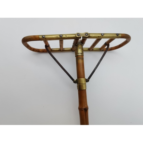 7 - A Victorian bamboo cane shooting stick with brass fittings, stamped 'BTE S.G.D.G.' to mount. 90cm lo... 