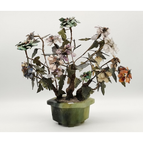 70 - A Chinese jade and quartz bonsai tree, with carved hardstone leaves and flowers, to a hexagonal jade... 