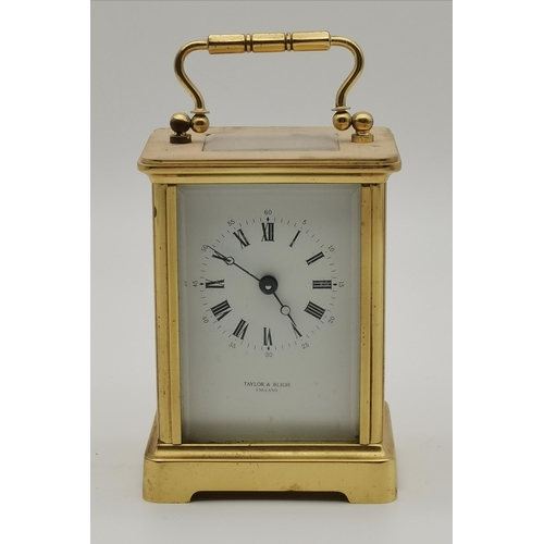 77 - A brass carriage clock, signed TAYLOR & BLIGH ENGLAND, with black Roman numerals, the movement signe... 