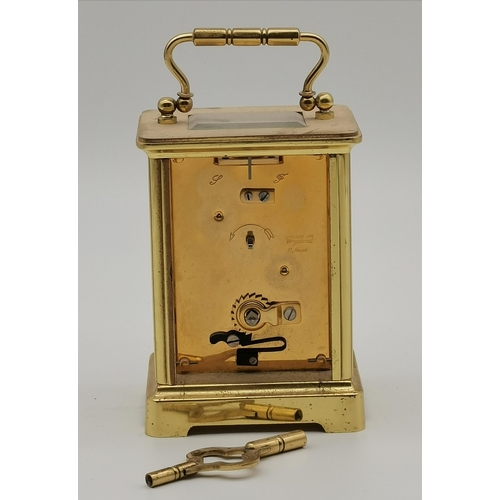 77 - A brass carriage clock, signed TAYLOR & BLIGH ENGLAND, with black Roman numerals, the movement signe... 