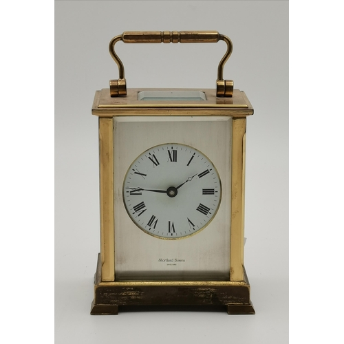 80 - A commemorative brass carriage clock, signed Shortland Bowen ENGLAND, with black Roman numerals, the... 