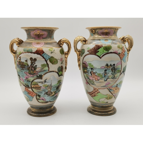 83 - A pair of Noritake twin-handled baluster vases, decorated with various assorted shaped panels with J... 