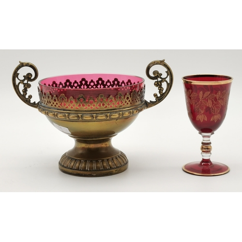 87 - A small group of assorted cranberry glass wares comprising a fluted bowl, baluster jug, pair of smal... 