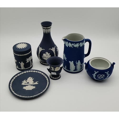 95 - A small collection of Wedgwood blue jasperware, including a royal blue twin-handled jar with GR VI c... 