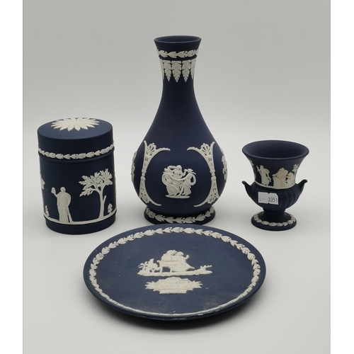 95 - A small collection of Wedgwood blue jasperware, including a royal blue twin-handled jar with GR VI c... 