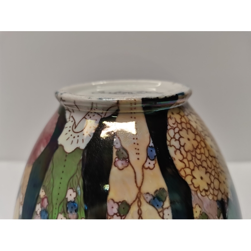 277 - A Royal Doulton porcelain biscuit barrel and cover, D4365, decorated with yellow blossom boughs to a... 