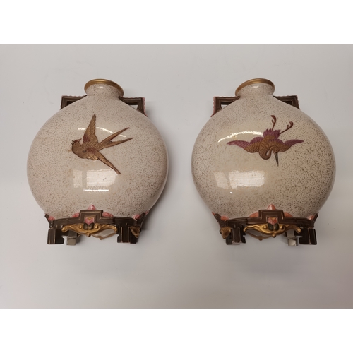 214 - A pair of Royal Worcester porcelain Japanese style moon flask vases, late 19th Century, with speckle... 