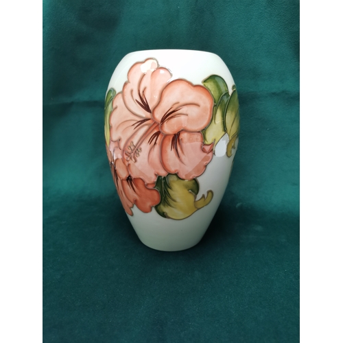 96 - A Cream Moorcroft Vase in Hibiscus design H19.5cm signature to base