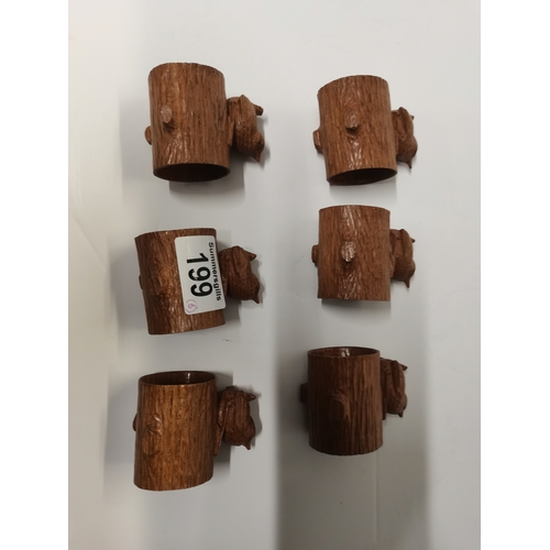 199 - Bob Hunter, a set of six Wrenman oak napkin rings, each with carved wren signature atop a hollowed o... 