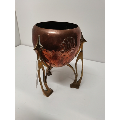 52 - An Art Nouveau copper and brass small jardinière, c.1910, rocket form, the ovoid copper planter repo... 