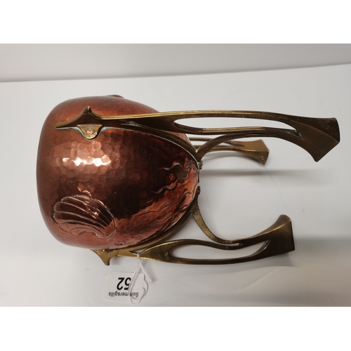 52 - An Art Nouveau copper and brass small jardinière, c.1910, rocket form, the ovoid copper planter repo... 