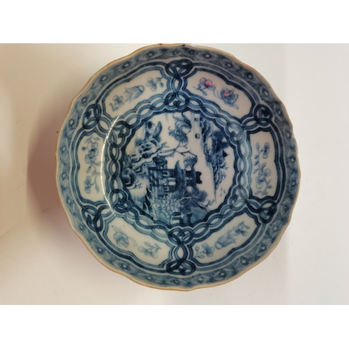 176 - A Chinese blue and white porcelain dish, with shaped edge, decorated to the well with a pagoda and t... 