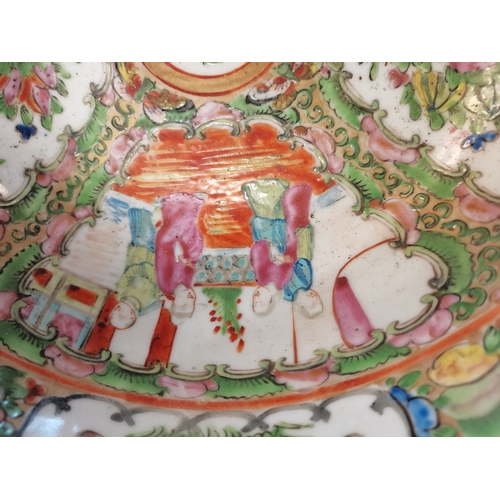 215 - A Chinese famille verte bowl, decorated to the well with four panels of alternating figural scenes a... 