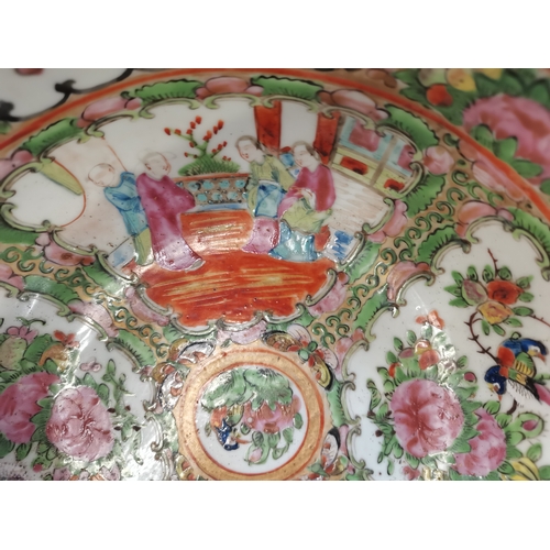 215 - A Chinese famille verte bowl, decorated to the well with four panels of alternating figural scenes a... 