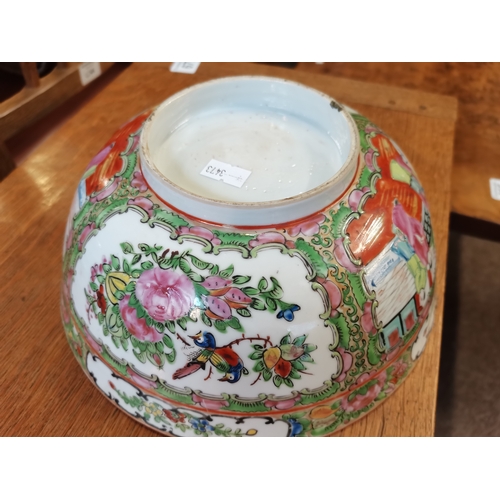 215 - A Chinese famille verte bowl, decorated to the well with four panels of alternating figural scenes a... 